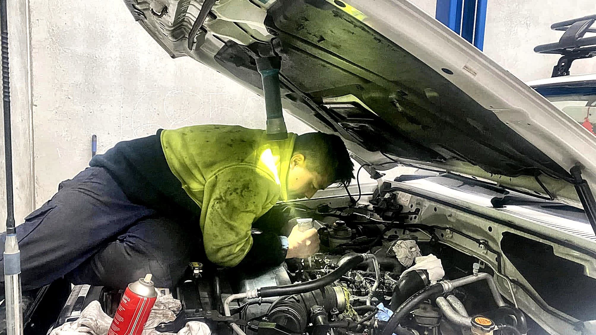 Gurkha Automotive mechanic servicing a vehicle in Sunshine North